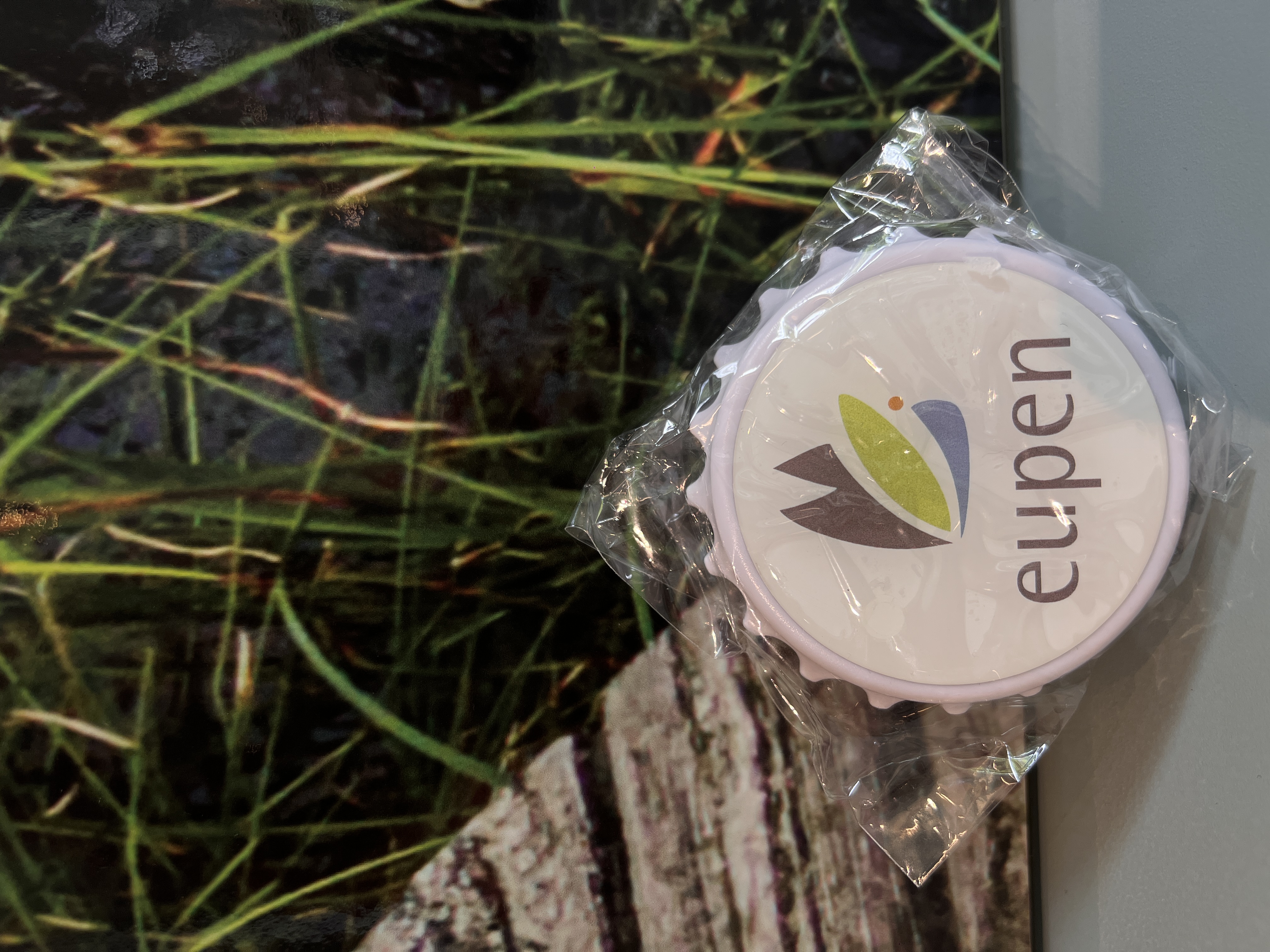 Décapsuleur en forme de capsule avec logo d’Eupen